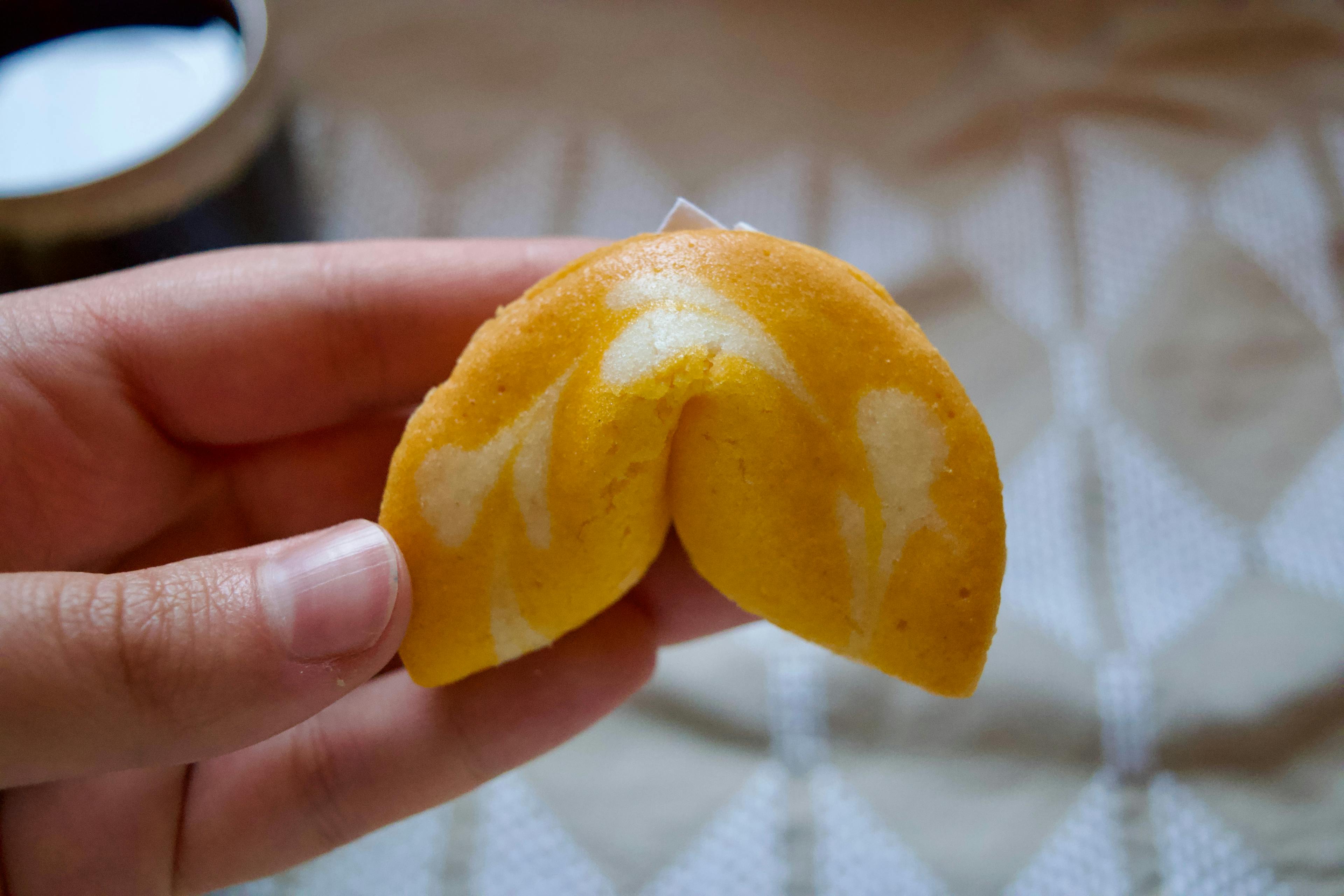 An orange fortune cookie