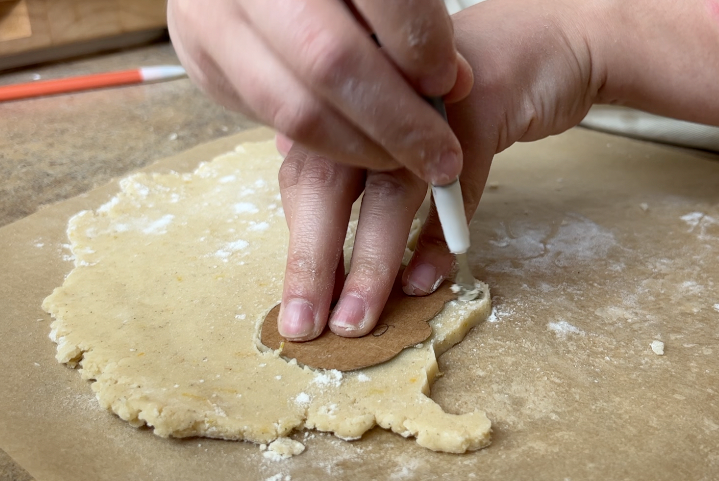 Cutting the elephant piece out of the dough