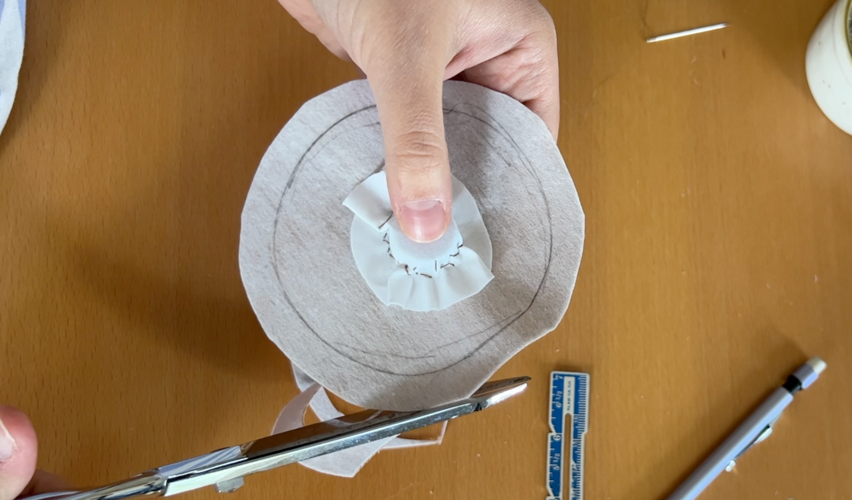 Stitching a magnet pocket to the brown circle