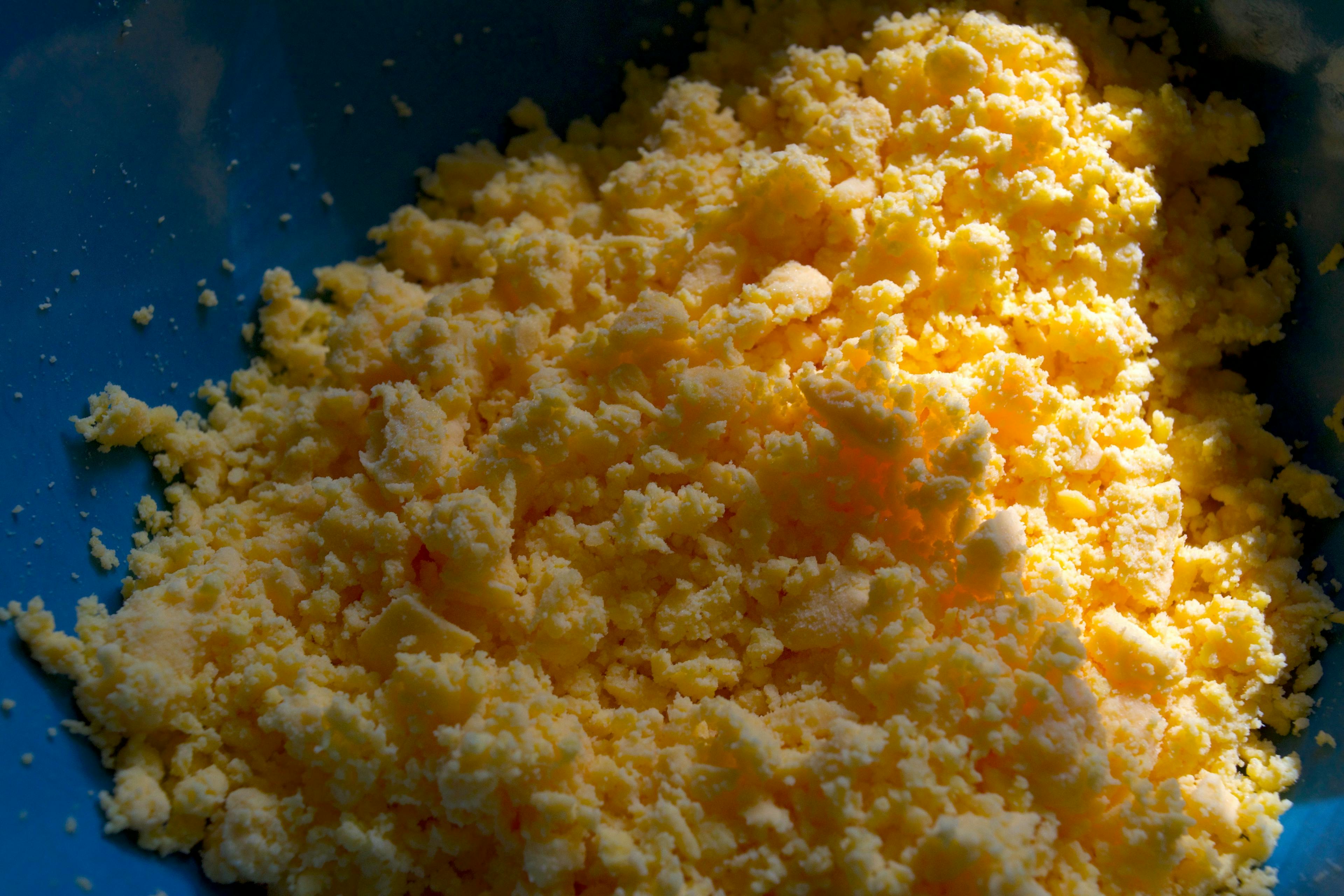 Bowl of smushed yolk crumbles.