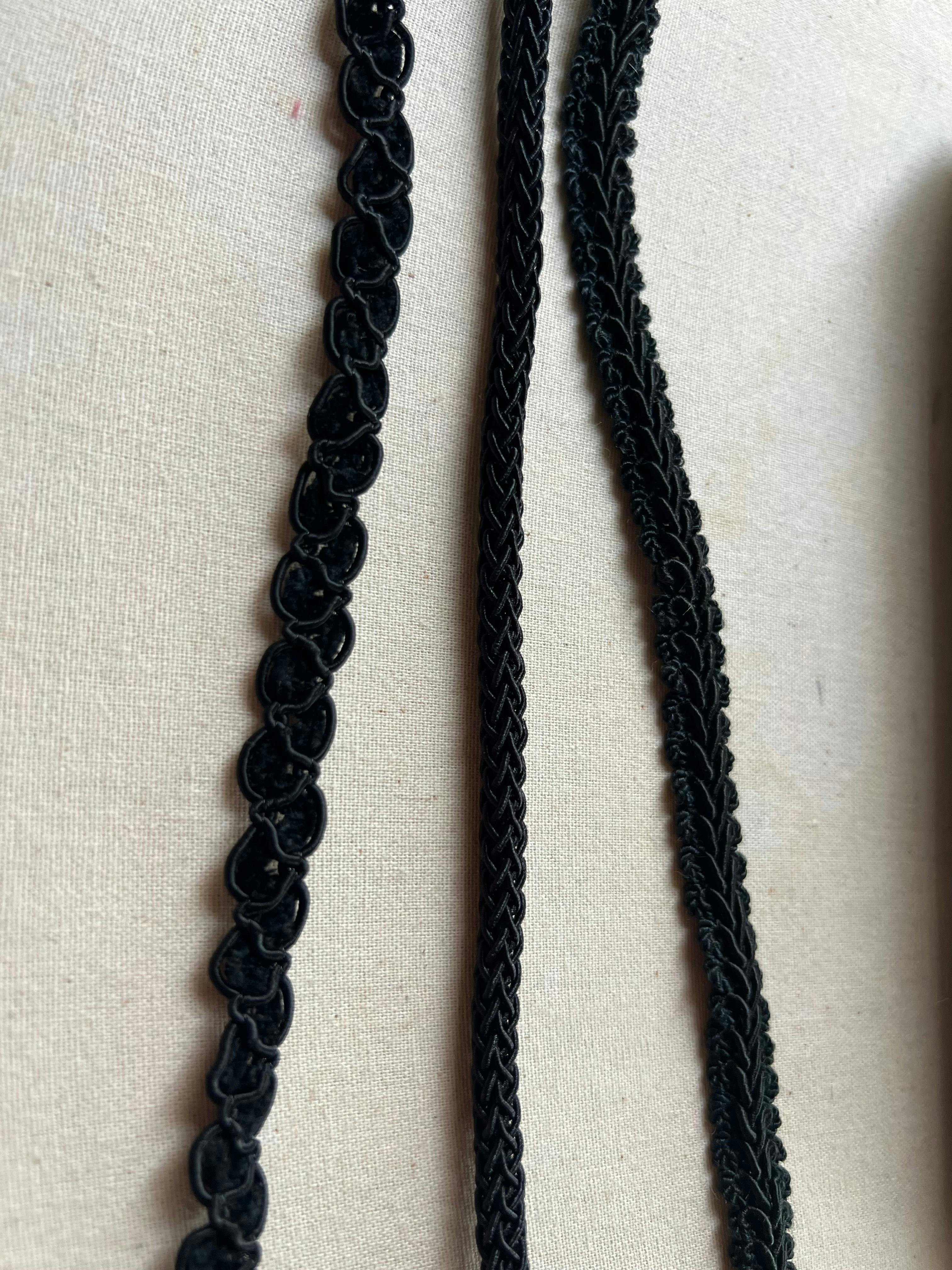 Three kinds of black braided cording.