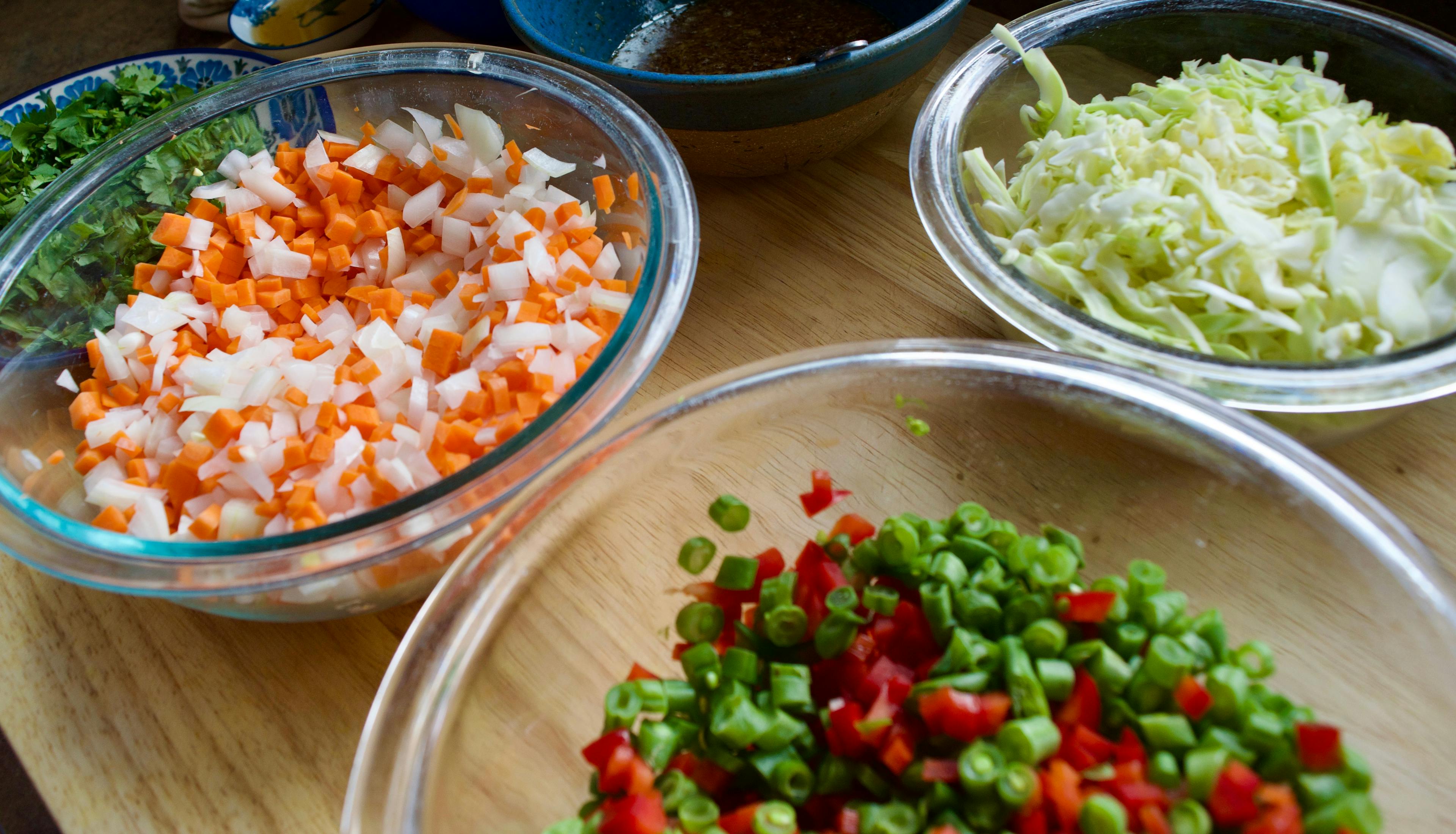 Diced veggies in clear glass bowls.
