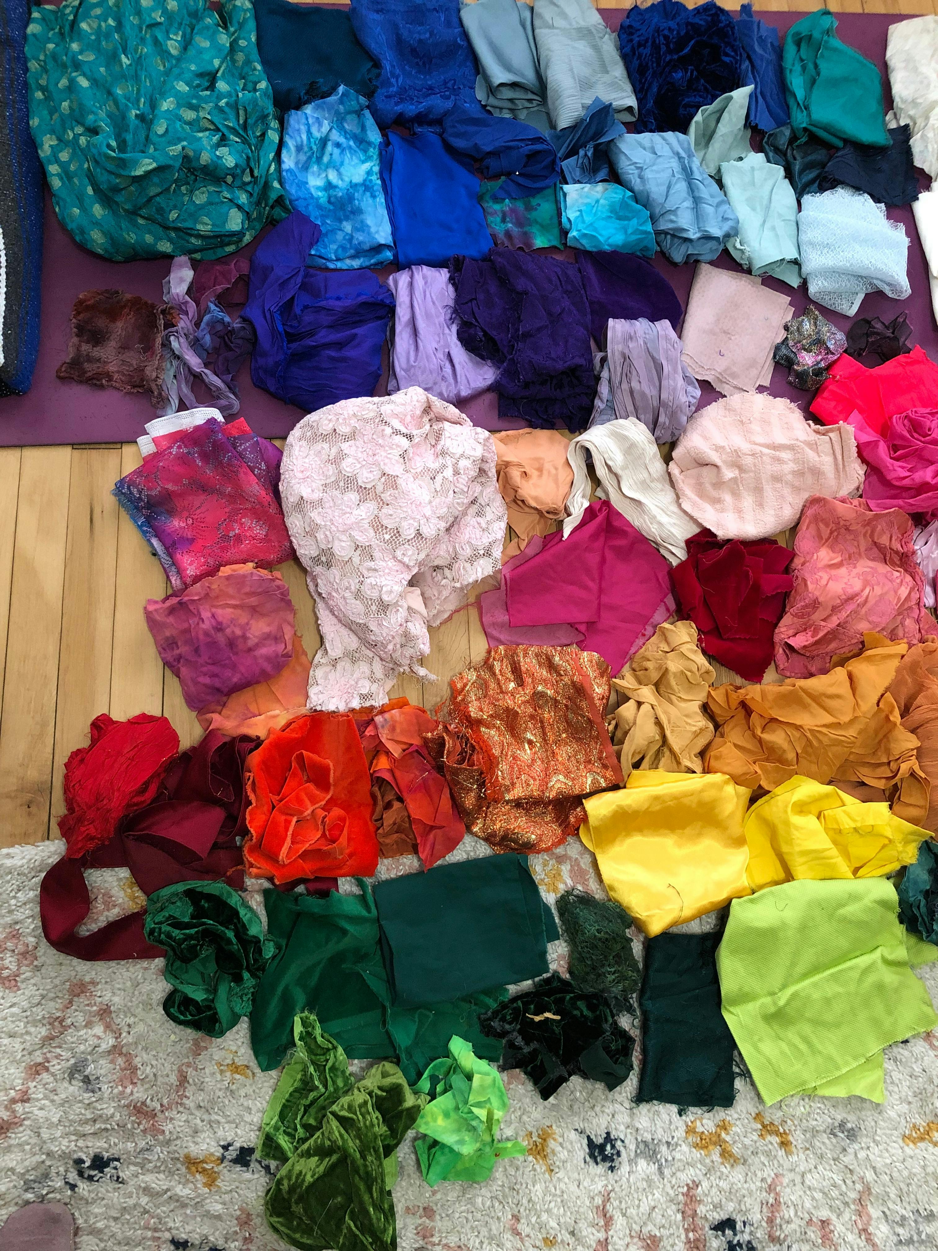 Half of the fabric for the bouquet laid out in rainbow order.