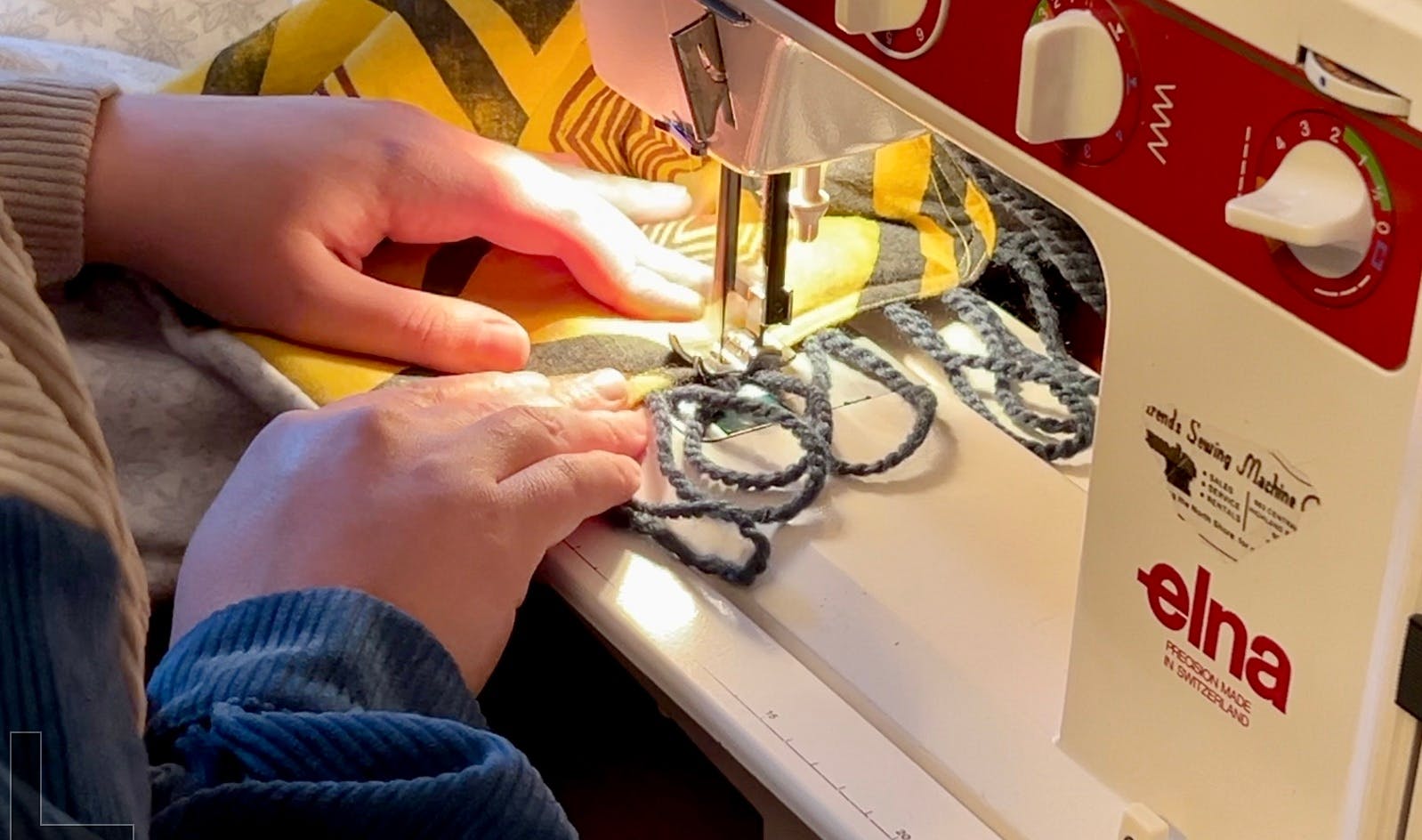 Machine stitching the top loops