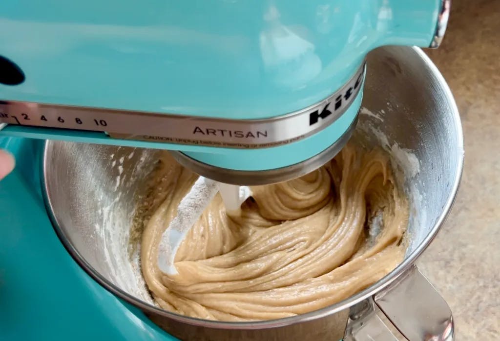 Stand mixer full of batter.